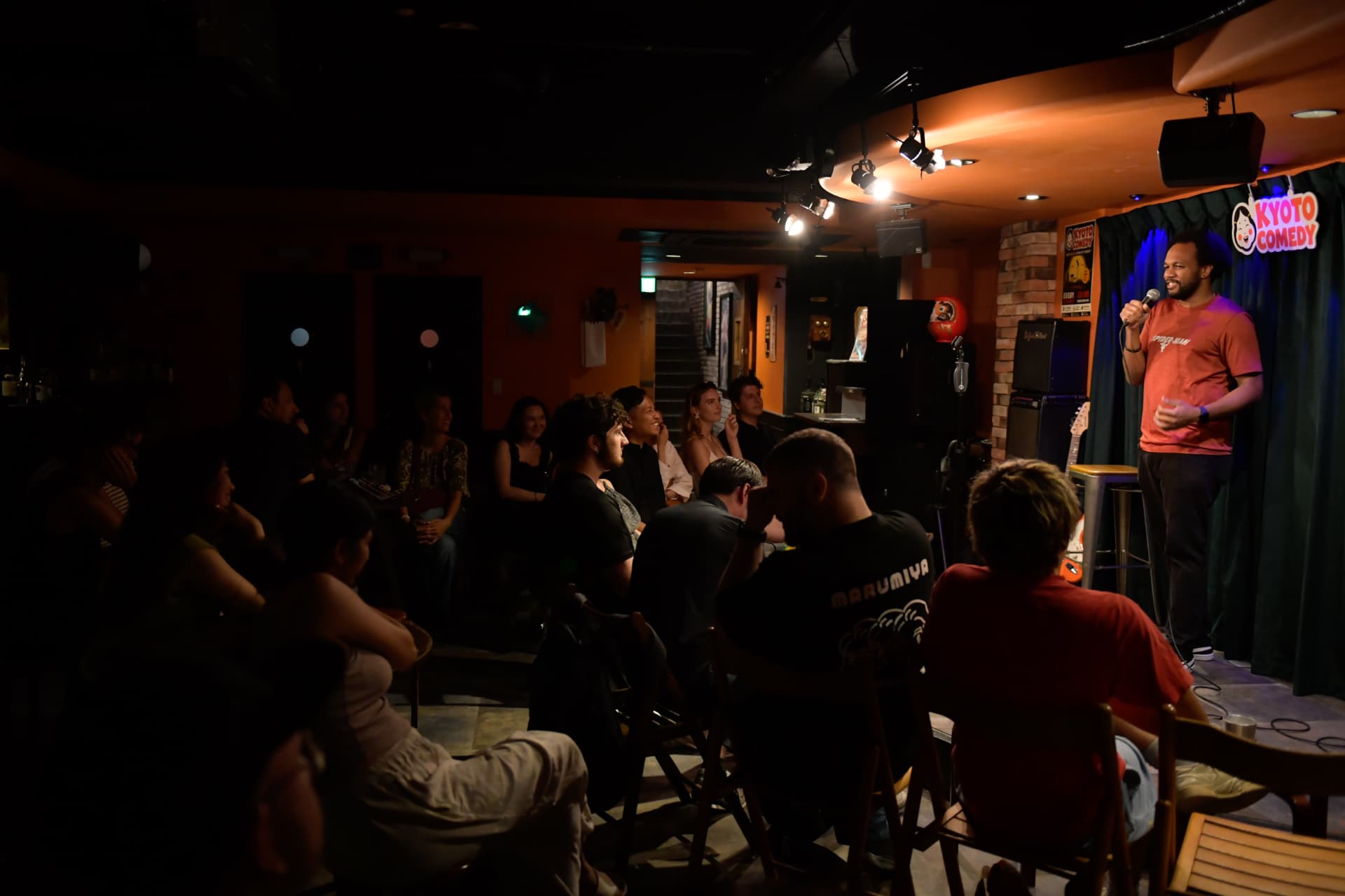 Comedian and full audience during an English comedy show at Ki Bar, Pontocho, Kyoto